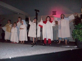 Children sing under the direction of Kris Miller & Jane Boatright
